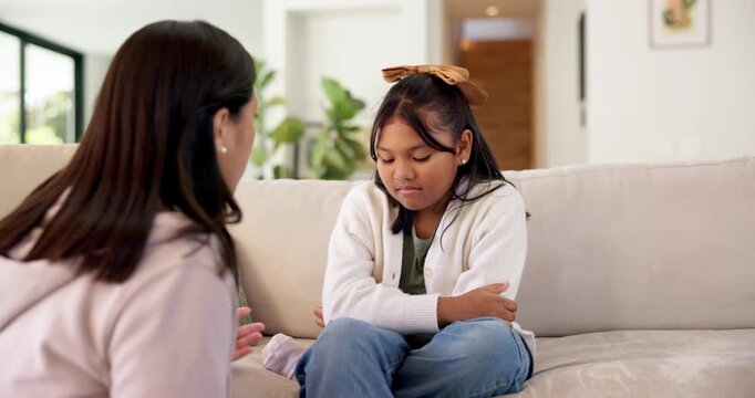 Mom, girl and sofa with discipline in home for gentle parenting, obedience or boundary. Mother, talking or speaking with child, listening or understanding for bad behavior or guidance in house