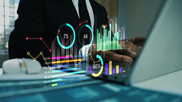 Businessman working on laptop with hologram business data graph bar chart on the screen, Digital data hologram interface financial analytics dashboard bar chart growth