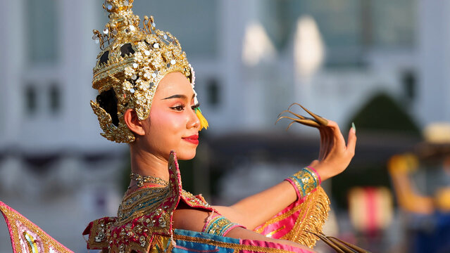 Traditional Thai Manohra Dancer in Ornate Gold Costume at Wat Suthat