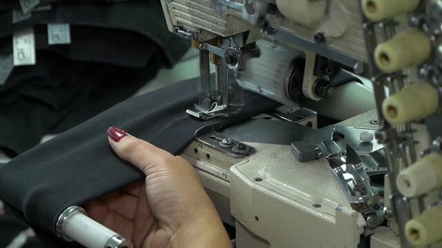Sewing machine in operation. 2 Shots.
Feed dog and presser foot.
