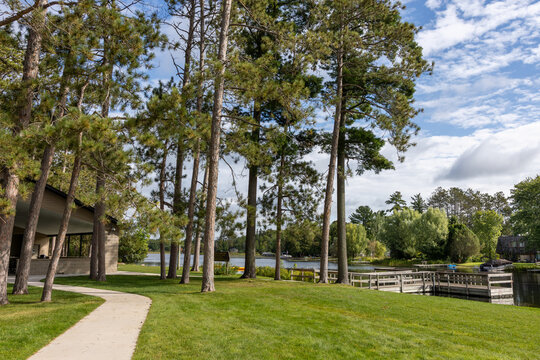 Pine River Park and Waterfront with Tall Pine Trees and Walking Path in Pine River, Minnesota