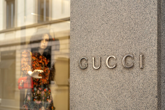 Gucci Storefront Window Display With Floral Dress Mannequin and Branded Sign on Stone Fa&ccedil;ade Milan Italy May 14, 2026