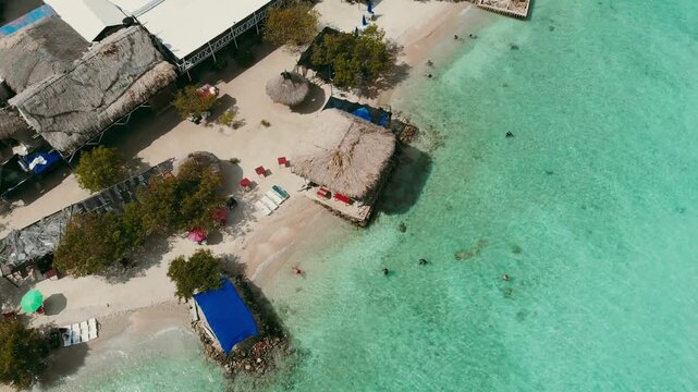 Drone ascending shot revealing coastline and sea of isla mucura