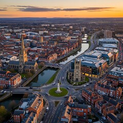 Obraz premium Historic City Center with Churches and Canal at Sunset From Aerial View