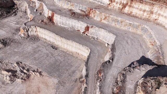 High Angle View of Industrial Limestone Quarry with Mining Operations and Rock Layers