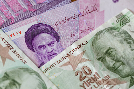 The value of Iranian rials vs. Turkish lira. Financial concept. Business background. Turkish and Iranian money. Flat lay. Close up.