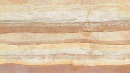 Obraz na płótnie Canvas Horizontal layered rammed earth wall texture background. Abstract natural clay, sand, and soil pattern with beige, orange, and brown stripes for organic interior design and architecture mockup.