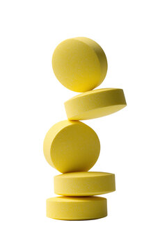 Yellow Round Tablets Stacked in Delicate Vertical Balance Isolated on Transparent Background PNG