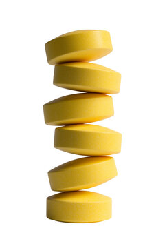 Yellow Round Tablets Stacked in Delicate Vertical Balance Isolated on Transparent Background PNG