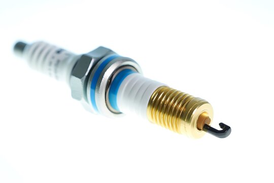 Close up of a single metallic spark plug with blue accents ignition engine