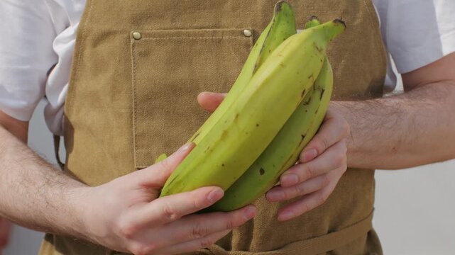 Grilled Banana on fire, latin american vegan grill with avocado and pepper, thai or Ecuadorian Street food. African traditional food on grill. 