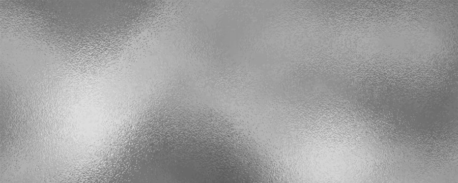 Shiny silver foil metallic texture - glossy gray steel gleaming surface, frosted glass effect with blur glare reflection, bright polished metal material.