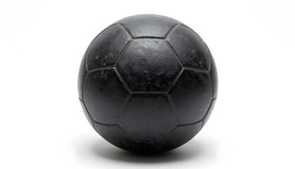 Fototapeta premium A dark, textured soccer ball sits centered on a clean white background