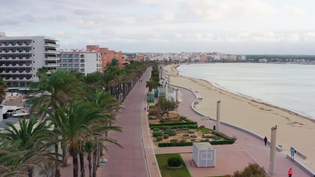 Drone view of Can Pastilla on Mallorca island showing sandy beach coastline tourist attractions and relaxing seaside destination in Spain Europe