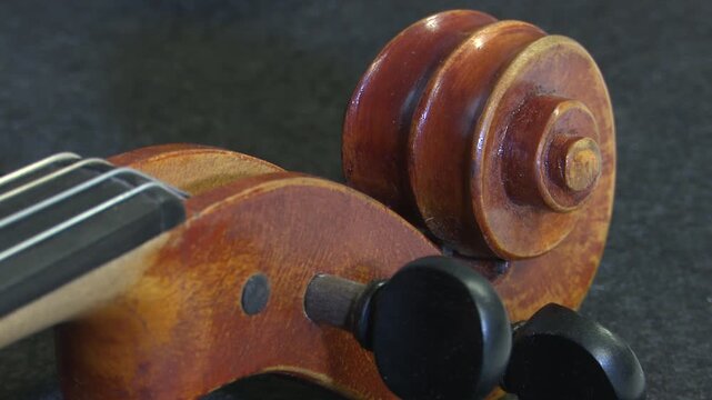 Bilbao, spain; may 21 2022: close up of a violin scroll and pegbox