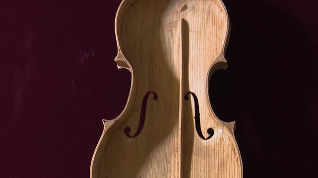 Bilbao, spain; may 21 2022: unfinished handmade violin lying in a luthier's workshop