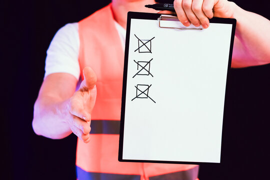 Worker showing thumbs up despite unchecked tasks