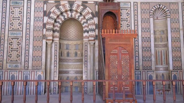 Slow motion upward camera movement inside historic mosque in Cairo, Egypt. Majestic Islamic interior with ornate ceiling, arches, and architectural details captured in cinematic 4K travel footage.