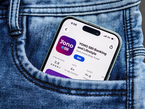 Smartphone showing the yono sbi banking and lifestyle mobile application store page inside a blue denim jeans pocket
