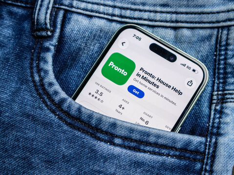 A smartphone showing the pronto app store page inside a blue denim jeans pocket