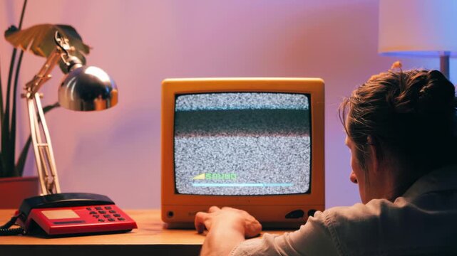 Retro TV, vintage television In a nostalgic setup, a retro TV displays grain on screen, scary halloween night device good for chroma key and green screen.