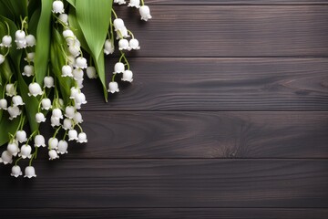 Fototapeta premium Delicate lily of the valley flowers blooming on a rustic dark wooden surface