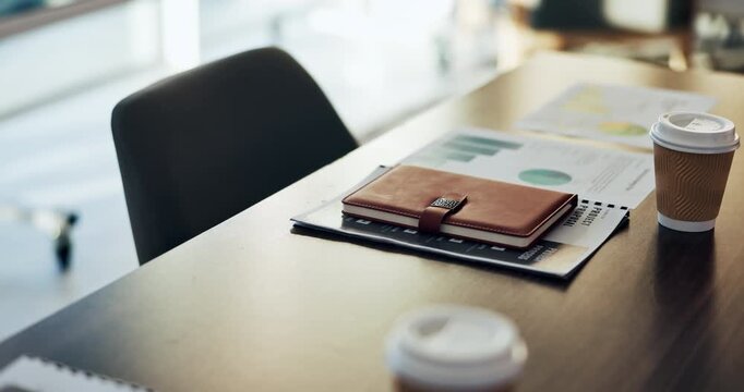 Empty, chart and desk with documents in office for finance meeting with graphs, proposal and report. Corporate space, business and coffee with paperwork, notebook and workplace for financial review