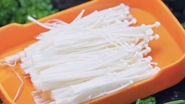 Fresh enoki mushrooms for hot pot