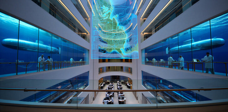 Futuristic underwater research facility interior featuring a vast multi-level atrium with enormous glass viewing walls revealing submarines and marine life in a deep blue oceanic environment, sci