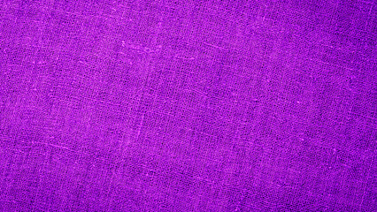 Fototapeta premium Close up view of purple fabric texture with patterns and weave details shown in bright light at home