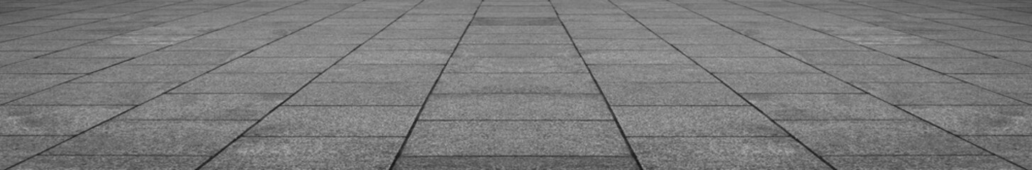 Obraz premium empty stone floor top in perspective. grey tile floor background in perspective view. line. empty copy space stone street. pavement. Granite outdoor tiled floor. gray granite. Marble texture