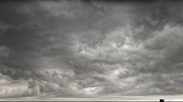 Sky before storm. Stormy cloudy sky wide panorama. Storm cloudy dramatic sky with dark rain grey cumulus cloud and blue sky. Timelapse.
