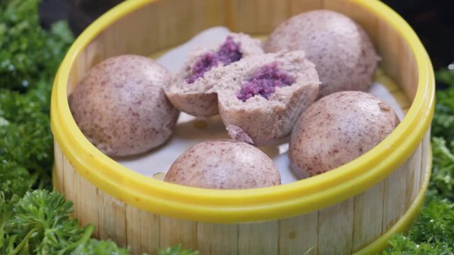 Cut open to reveal the filling of the purple rice and purple sweet potato multigrain bun