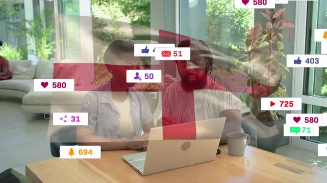 Man pointing at screen woman typing at laptop starting rising social badges and driving engagement