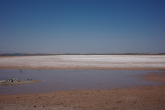 White salt flat and dry lake surface in an arid desert basin