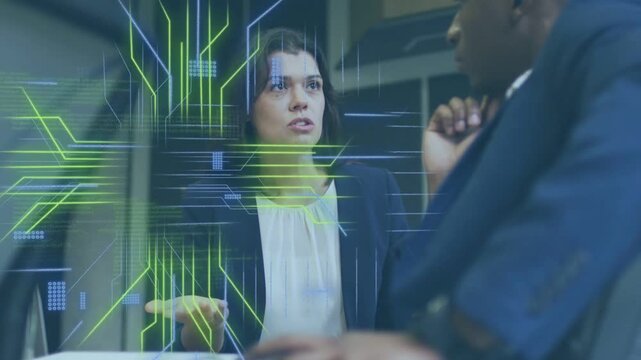 Woman talking, pointing in biz demo sparking circuit code overlay rising then fading man noting