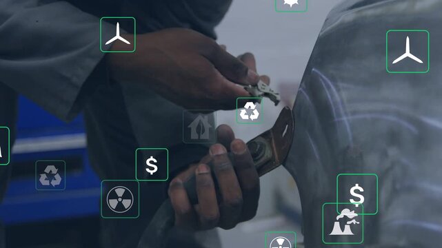 Technician gripping pliers, aligning bracket on auto fender, securing part while energy icons drift