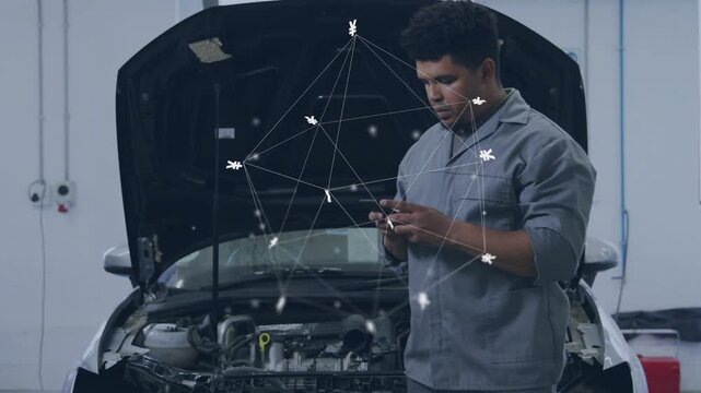 Male technician tapping phone and activating animated network overlaying engine for diagnostics