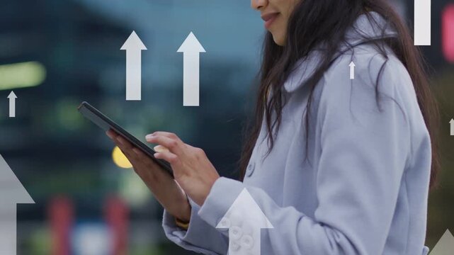 Woman tapping tablet by city railing causing tech arrows showing gains while camera revealing smile