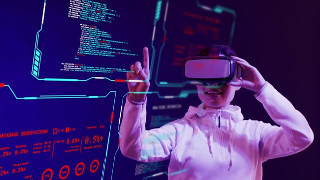 Adult woman holding VR headset steadying headset while tracing tech charts selecting data