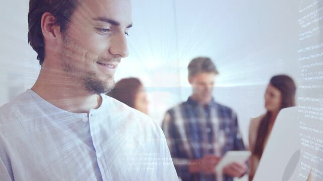 Man typing laptop in business office, light streaks tracking input while sharing progress with team