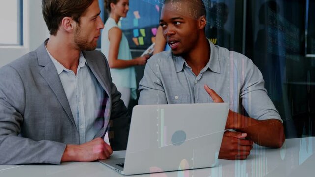 Speaker starting biz data review pointing to laptop, two men leaning in and viewing overlaid charts