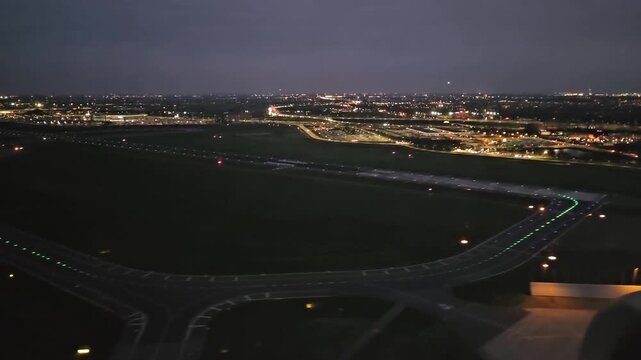 A plane approaches Schiphol Airport. A view of Amsterdam in the late evening. Flight Krakow to Amsterdam. 
