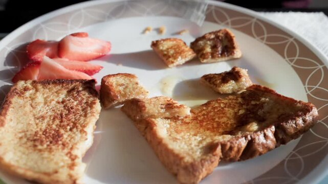 French toast and strawberries on a plate for breakfast