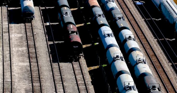 Aerial view of industrial tanker cars parked on parallel tracks in a rail yard in Cincinnati, Ohio, United States.