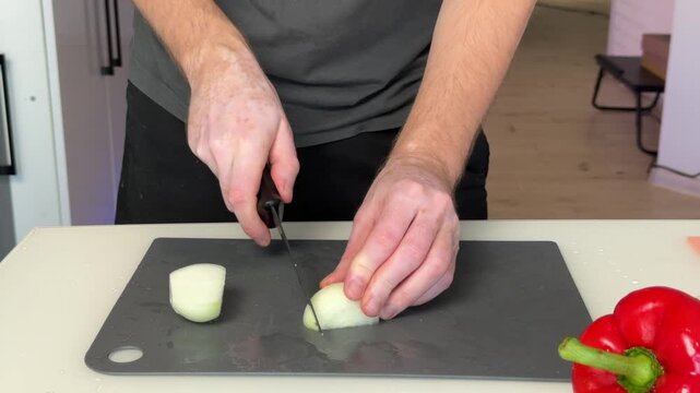 Slicing White Onion For Flavorful Dishes. Detailed Onion Cutting Process For Aromatic Culinary Base