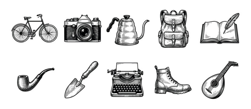 Set of vintage adventure and hobby icons including a bicycle, camera, and typewriter, illustrated in a detailed black and white engraving or woodcut art style