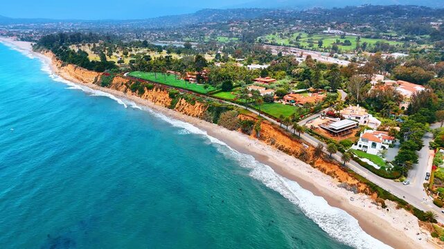 Descend over the turquoise waterscape of the Pacific Ocean. View on the gorgeous Butterfly Beach in Montecito area of Santa Barbara, California, USA.