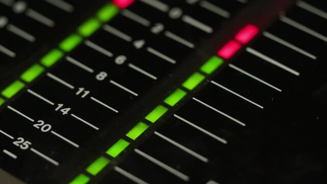 Music studio close up, Close up hands shot of sound engineer using mixing console, remote control for adjusting sound, audio mixer. Musician creates music, makes remix for DJ set. Sound recording