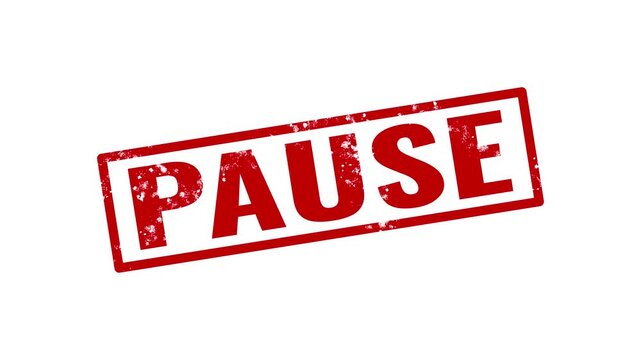 Red ink rubber stamp with the word pause